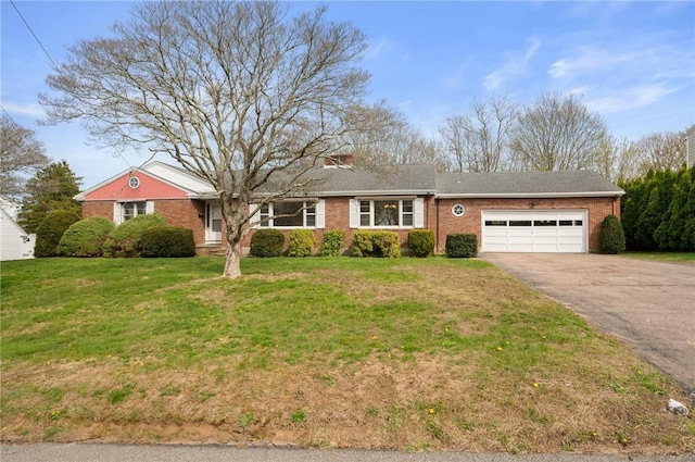 21 Top St, Westerly, RI 02891 - single story home featuring an attached garage, driveway, a front lawn, and brick siding