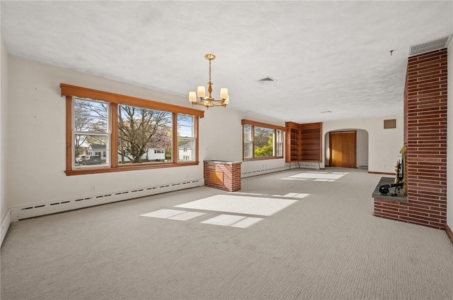 21 Top St, Westerly, RI 02891 - unfurnished living room with an inviting chandelier, carpet floors, visible vents, a baseboard heating unit, and arched walkways