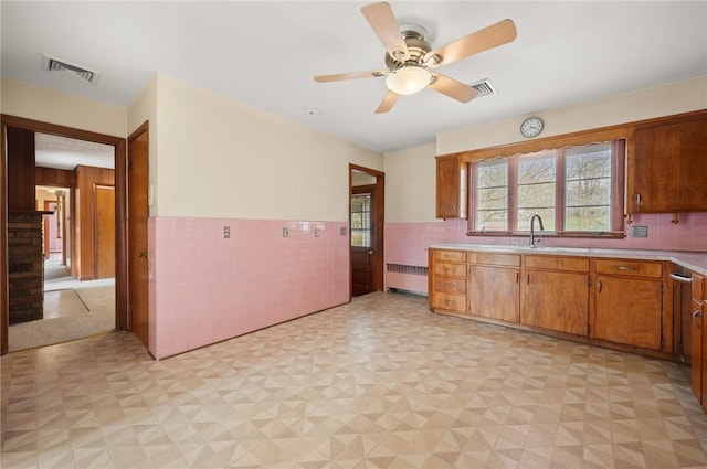 21 Top St, Westerly, RI 02891 - kitchen featuring a ceiling fan, visible vents, light countertops, radiator heating unit, and light floors
