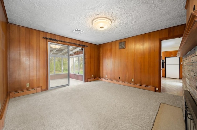 21 Top St, Westerly, RI 02891 - unfurnished room with carpet floors, wood walls, a baseboard heating unit, and visible vents