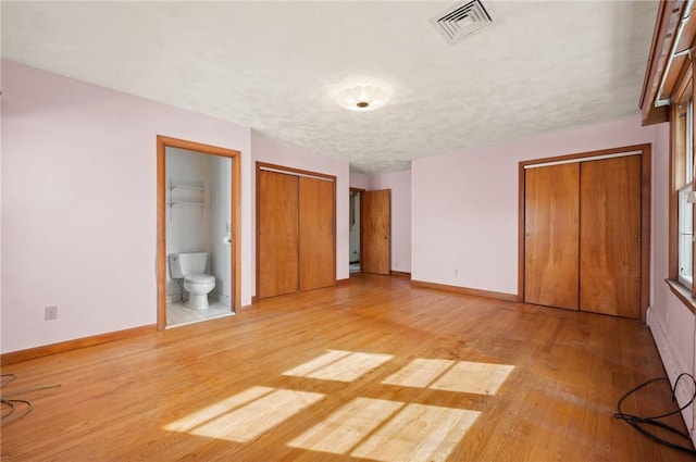 21 Top St, Westerly, RI 02891 - unfurnished bedroom featuring baseboards, light wood-style flooring, and visible vents