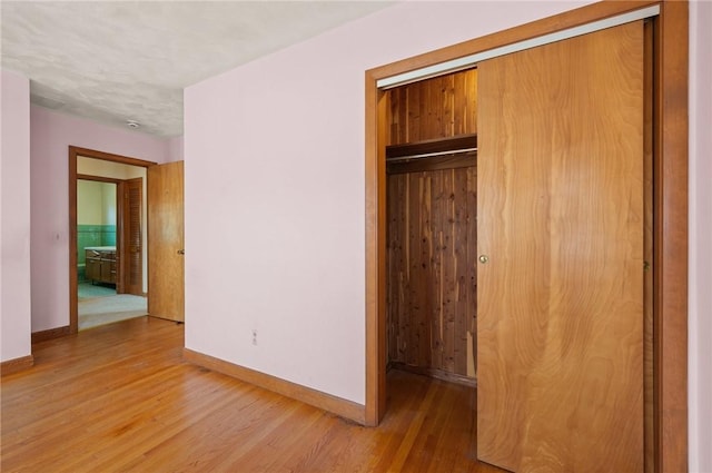 21 Top St, Westerly, RI 02891 - unfurnished bedroom with baseboards, wood finished floors, and a closet
