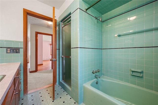21 Top St, Westerly, RI 02891 - bathroom with tile patterned flooring, a shower with shower door, vanity, a washtub, and tile walls