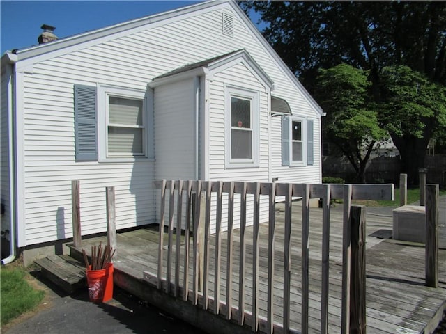 23 Pengrove St, Cranston, RI 02920 - view of front facade with a deck and a chimney