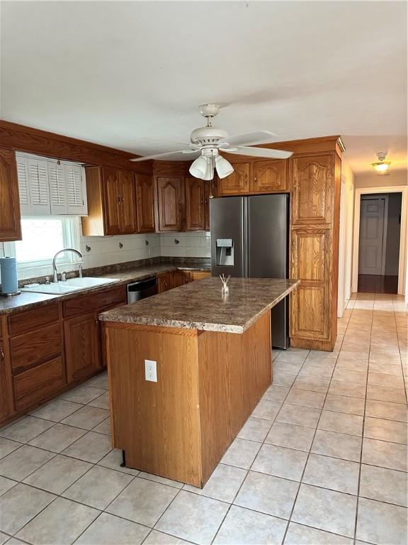 23 Pengrove St, Cranston, RI 02920 - kitchen featuring a sink, light tile patterned flooring, stainless steel appliances, a kitchen island, and ceiling fan