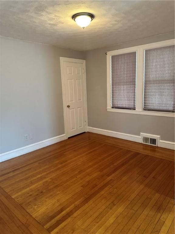 23 Pengrove St, Cranston, RI 02920 - empty room with wood-type flooring and baseboards