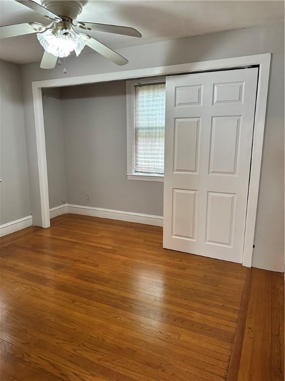 23 Pengrove St, Cranston, RI 02920 - unfurnished bedroom featuring wood finished floors, baseboards, and ceiling fan