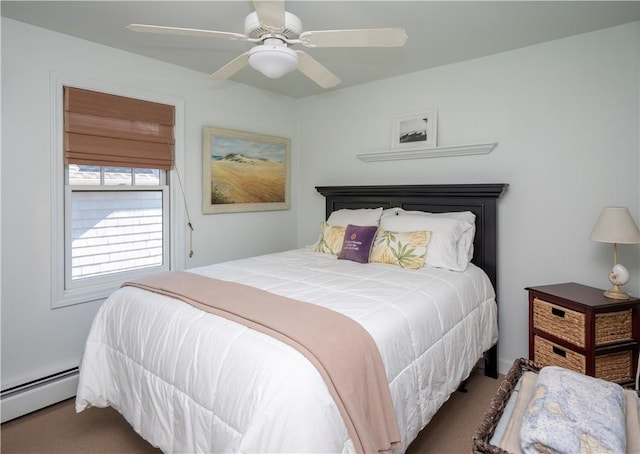 carpeted bedroom featuring a baseboard radiator and a ceiling fan