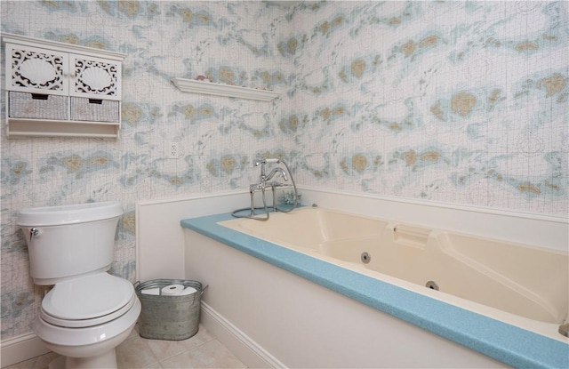full bathroom with tile patterned floors, toilet, baseboards, a jetted tub, and wallpapered walls