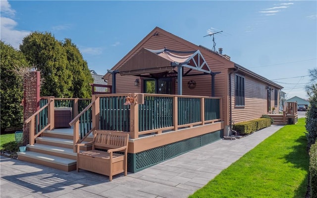 exterior space featuring a yard and a wooden deck