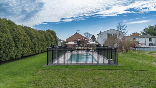 view of pool featuring a fenced in pool, a yard, a patio area, and fence