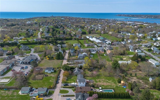 bird's eye view with a water view and a residential view