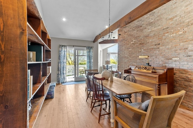 dining area with recessed lighting, brick wall, and hardwood / wood-style floors