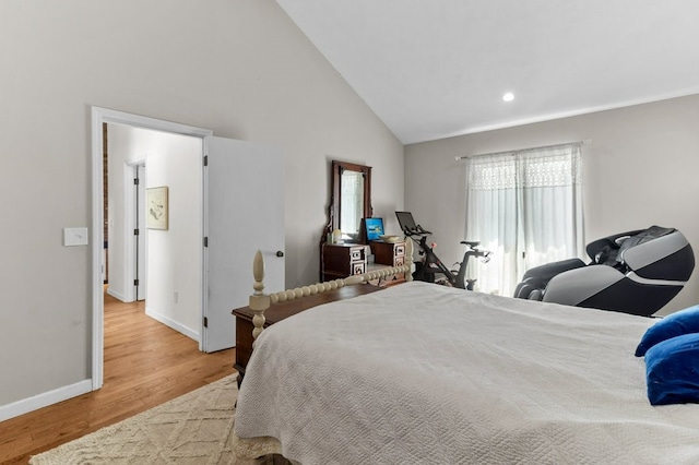 bedroom featuring recessed lighting, baseboards, wood finished floors, and high vaulted ceiling