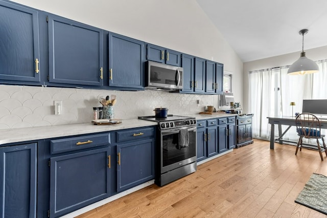kitchen featuring light wood-style floors, stainless steel appliances, and blue cabinetry