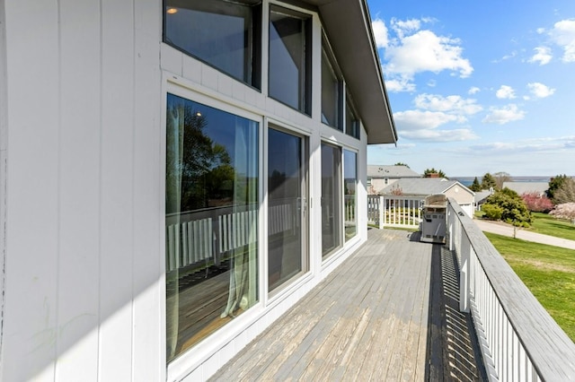 wooden deck featuring a grill