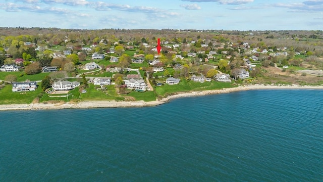 drone / aerial view with a water view and a residential view