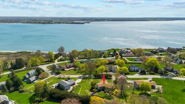 drone / aerial view featuring a water view and a residential view