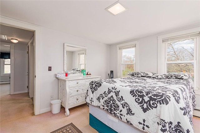 141 Canal St, Westerly, RI 02891 - bedroom with a baseboard radiator, light carpet, and baseboards