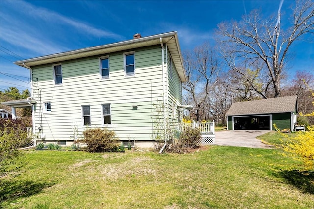 141 Canal St, Westerly, RI 02891 - view of property exterior featuring an outdoor structure, a chimney, a detached garage, and a yard