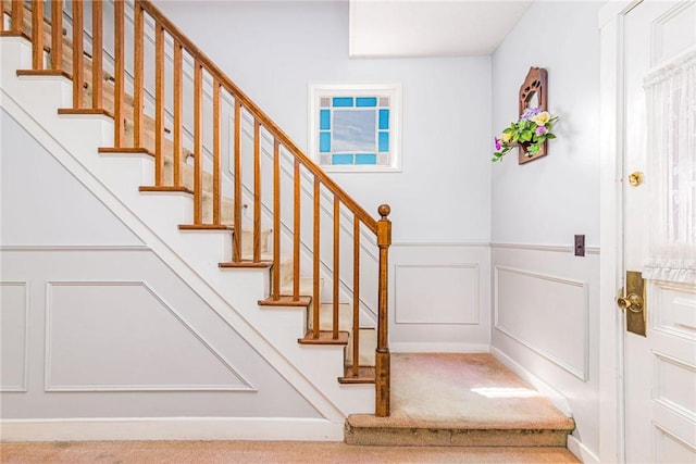 141 Canal St, Westerly, RI 02891 - stairs featuring carpet, a decorative wall, and wainscoting