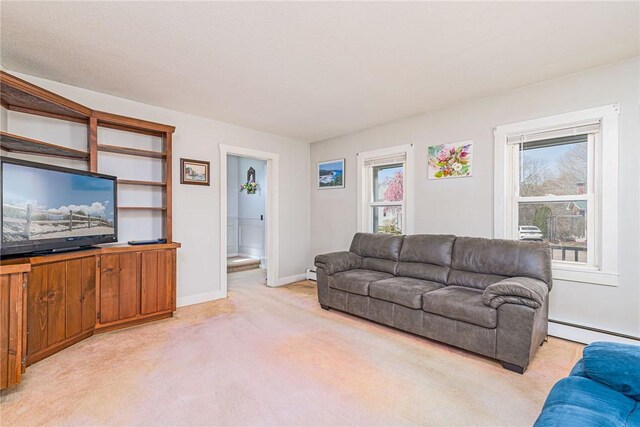 141 Canal St, Westerly, RI 02891 - living area featuring baseboards, a baseboard heating unit, and light carpet