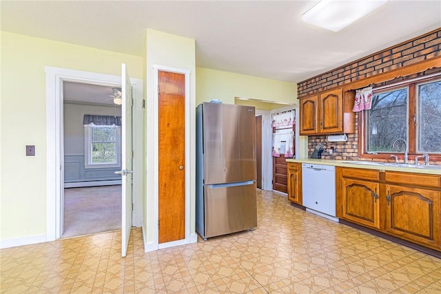 141 Canal St, Westerly, RI 02891 - kitchen featuring a sink, light countertops, white dishwasher, freestanding refrigerator, and light floors
