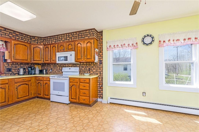 141 Canal St, Westerly, RI 02891 - kitchen with a baseboard heating unit, plenty of natural light, light countertops, and white appliances
