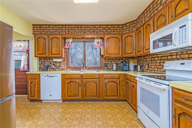 141 Canal St, Westerly, RI 02891 - kitchen featuring white appliances, brown cabinets, light countertops, and a sink