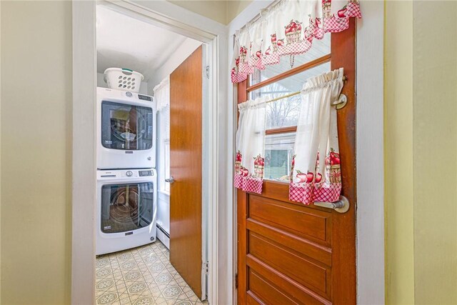 141 Canal St, Westerly, RI 02891 - washroom featuring stacked washer and clothes dryer, laundry area, and a baseboard radiator