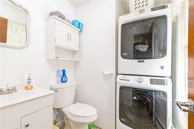 141 Canal St, Westerly, RI 02891 - bathroom featuring stacked washer / dryer, toilet, and vanity