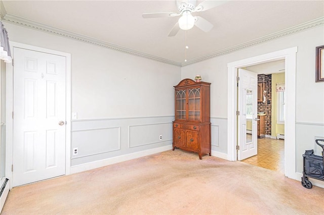 141 Canal St, Westerly, RI 02891 - bedroom with crown molding, light colored carpet, ceiling fan, a baseboard radiator, and a wainscoted wall