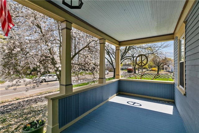 wooden deck featuring covered porch