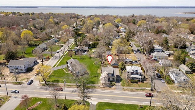 birds eye view of property featuring a residential view and a water view