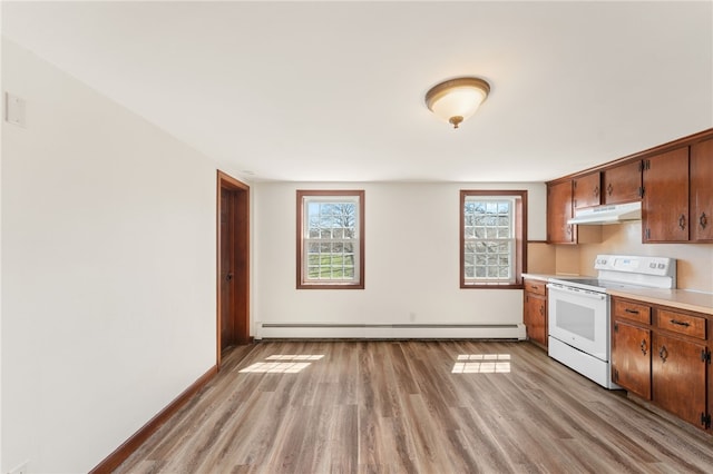 kitchen featuring a baseboard radiator, light countertops, under cabinet range hood, electric range, and light wood-type flooring