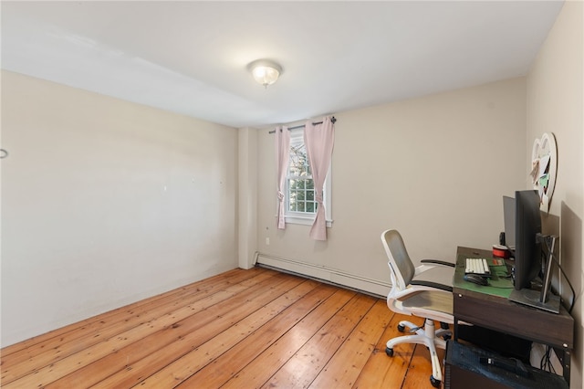 office space with baseboard heating and light wood-type flooring