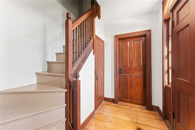 interior space featuring hardwood / wood-style flooring and baseboards