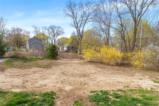 view of yard with an outbuilding and a barn