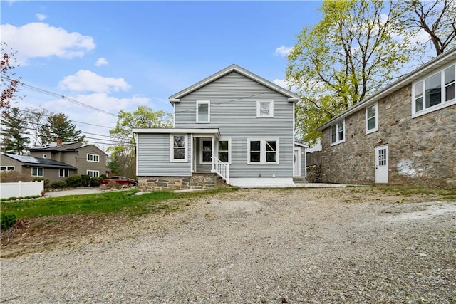rear view of property with entry steps