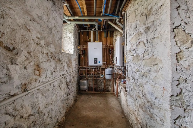 interior space with tankless water heater and water heater
