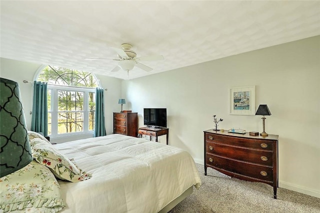 bedroom with baseboards, ceiling fan, and carpet flooring