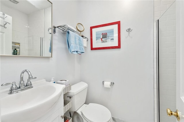 bathroom featuring toilet and a sink