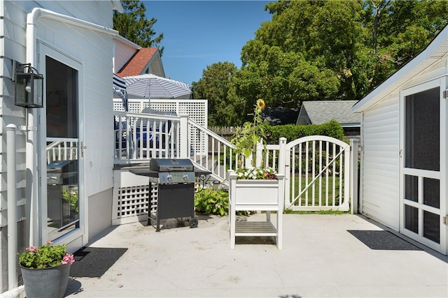 view of patio featuring a gate and grilling area