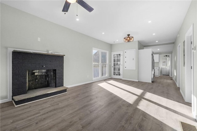 unfurnished living room featuring recessed lighting, wood finished floors, ceiling fan, and a fireplace