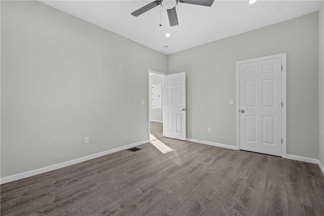 unfurnished bedroom featuring recessed lighting, wood finished floors, baseboards, visible vents, and a ceiling fan
