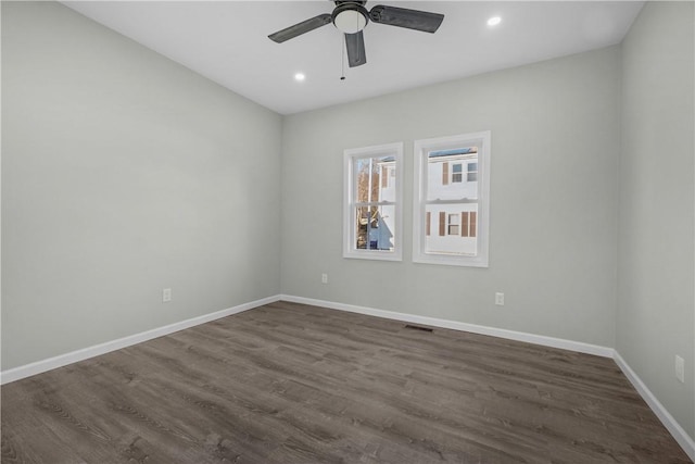 unfurnished room with baseboards, recessed lighting, ceiling fan, and dark wood finished floors