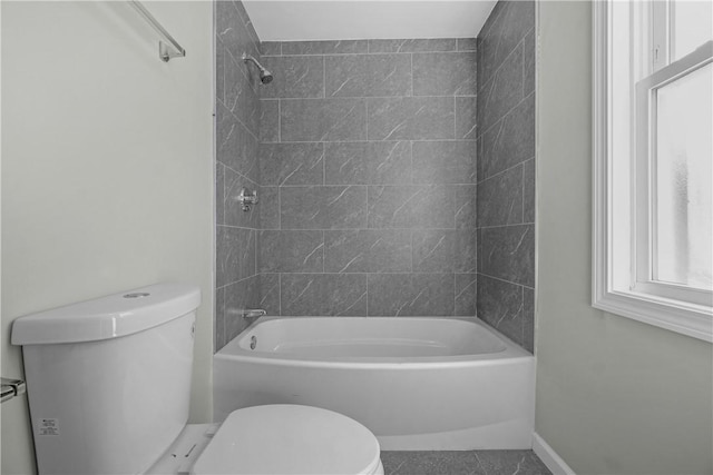 full bathroom featuring toilet, shower / tub combination, and tile patterned flooring