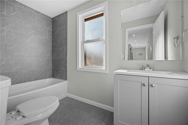 full bathroom featuring vanity, toilet, baseboards, tub / shower combination, and tile patterned flooring