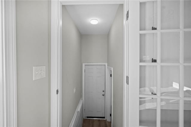 doorway featuring dark wood finished floors
