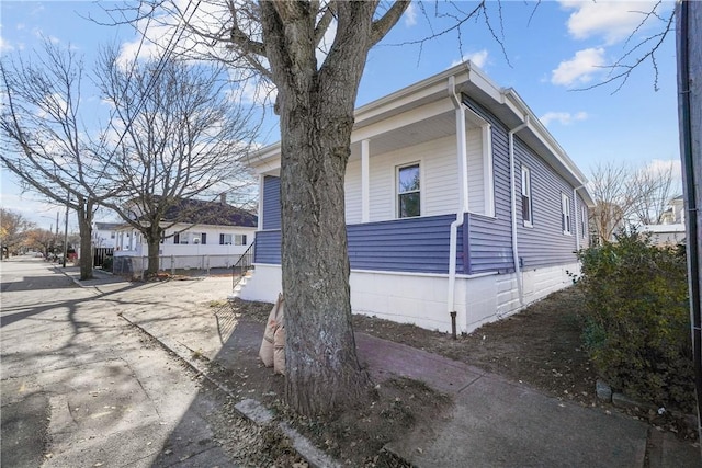 view of home's exterior with a porch
